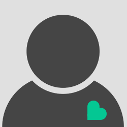 Vet doing a wellness exam on a little dog.